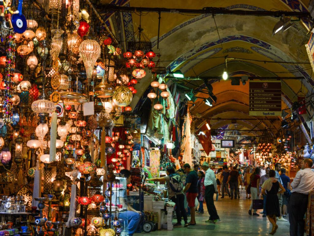 Mosaic Ottoman lamps from Grand Bazaar in Istanbul and people shopping