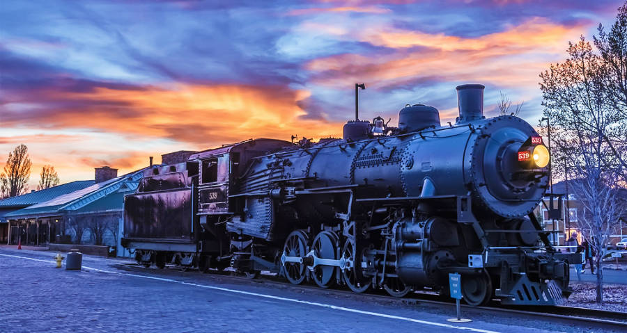 Colorful sky over the Grand Canyon Railway at Williams Station during sunset
