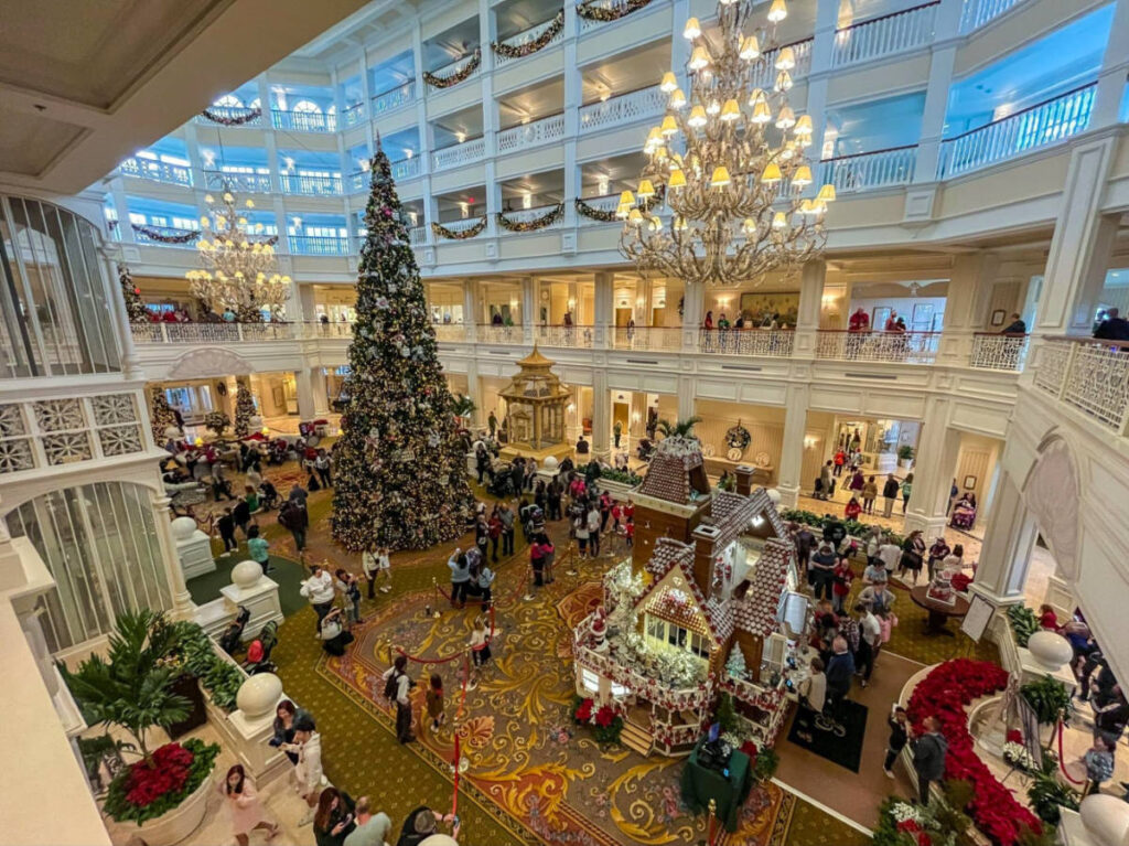 A festive view of Disney's Grand Floridian Resort adorned with Christmas decorations