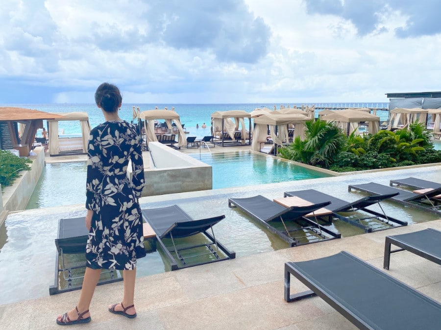 Clara admiring the view near the infinity pool in Grand Hyatt