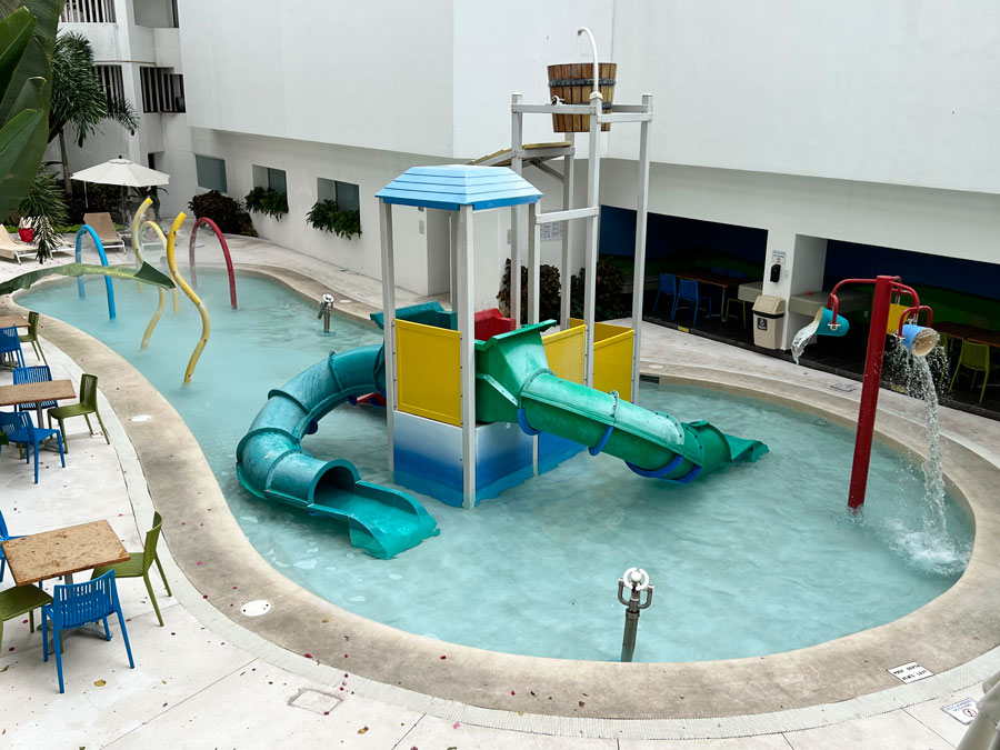 View of water slides for kids in a pool in Grand Park Royal