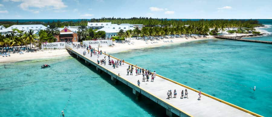 People crossing on the wide and long boardwalk on Grand Turk Island