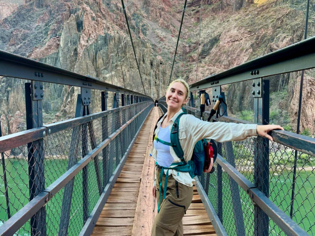Author's friend Kiva posing for a photo at the Grand canyon bridge