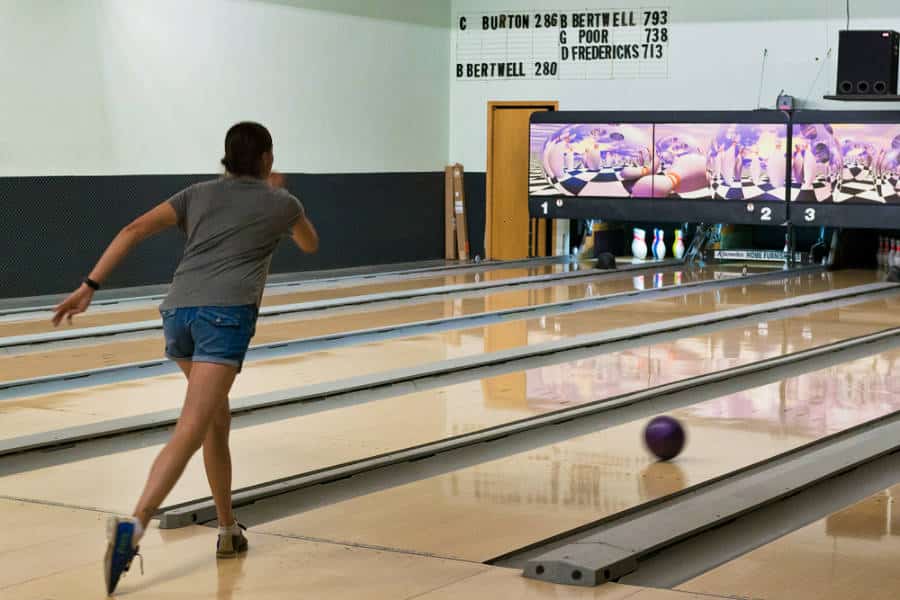 A woman playing bowling at Gravel Pit Lanes in Moab