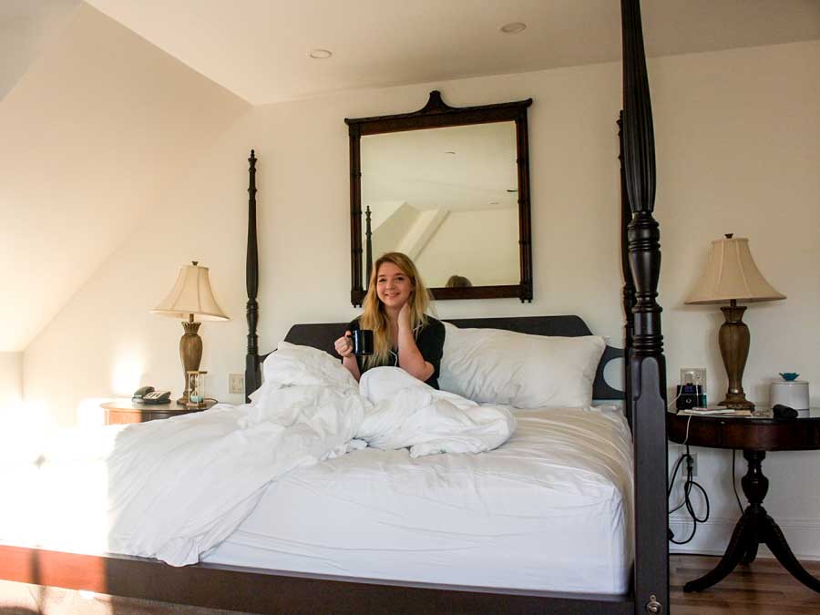 The author sitting on a bed in Great George Hotel