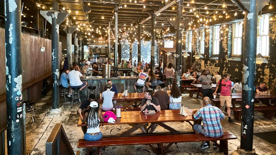 An industrial-styled interior view of the barbecue restaurant of Green Street Smoked Meats restaurant wit