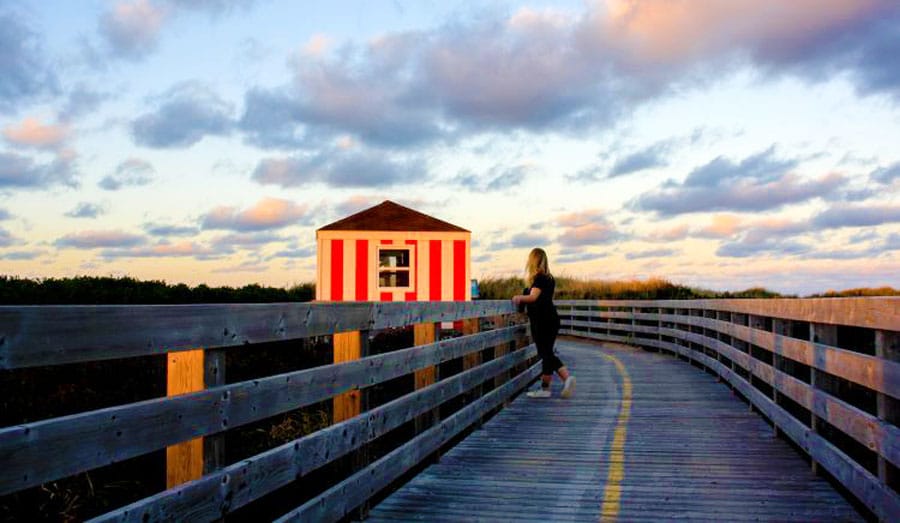 The author admiring the colorful sky in Greenwich PEI National Park