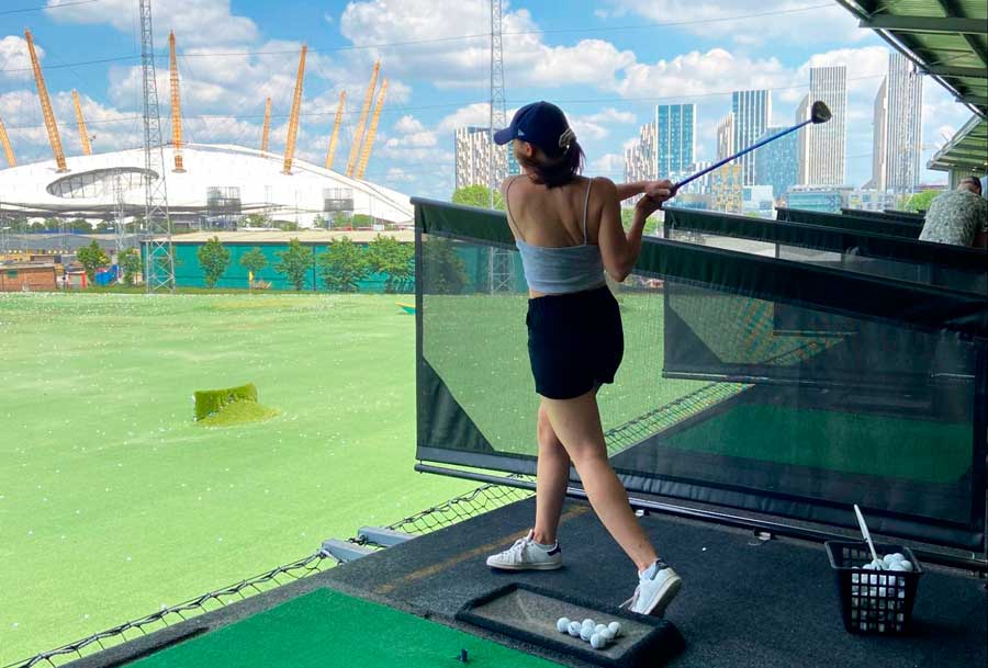 The author playing golf in Greenwich Peninsula during summer