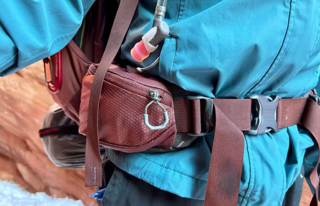 Close up view of the zipped hip belt pocket of the Gregory Maven backpack