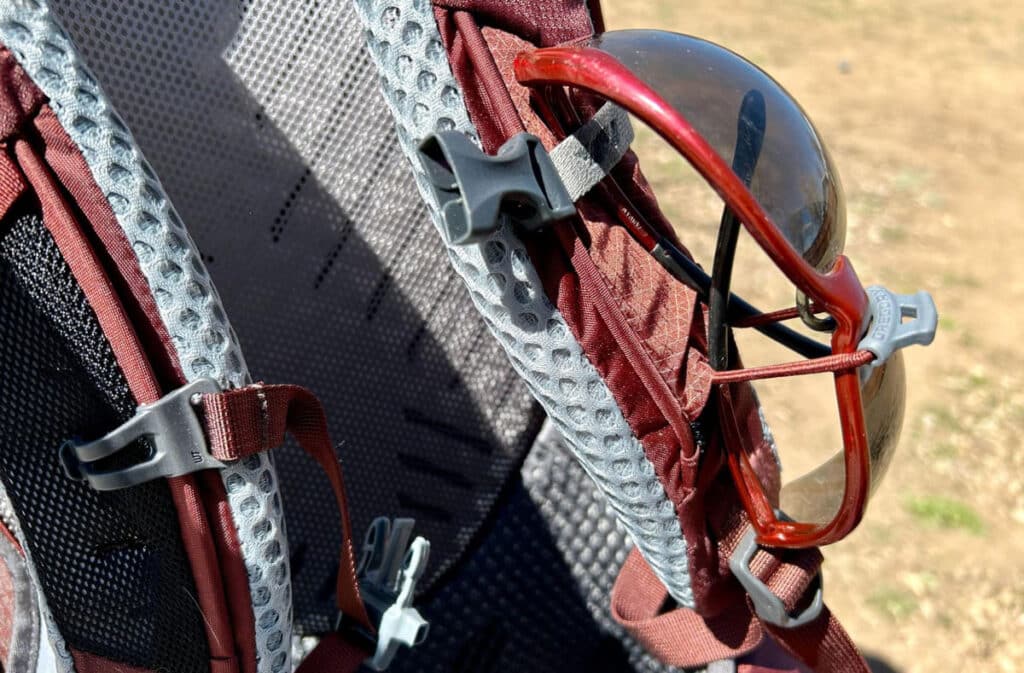 Close up view of a sunglasses on the quickstow system of the Gregory Maven backpack