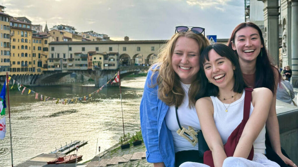 The author Lea Rose Allbaugh and her friends smiling for a photo in Florence, Italy