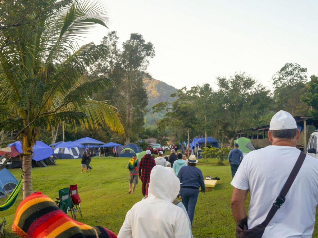 A group of people walking barefoot during Festival de Frío