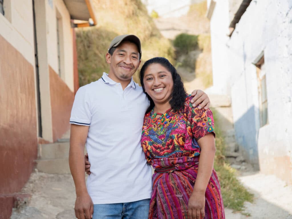 A married couple from Guatemala smiling for a photo