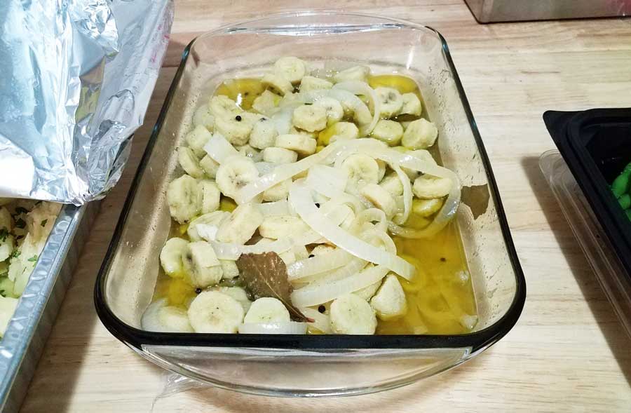 View of a banana with oil on a glass container