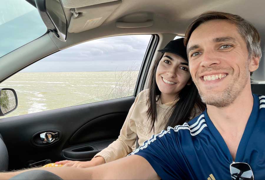 The author with his partner Clara taking a photo while on a road trip along the Gulf of Mexico