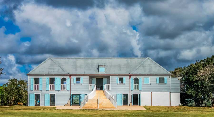 View of the Hacienda La Esperanza under the dark sky in Manati