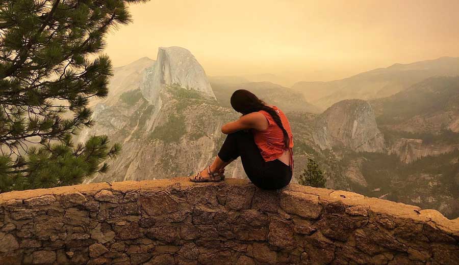The author posing in front of the half dome during the Yosemite National Park wildfire