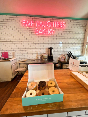 A box of half dozen donuts at Five Daughters Bakery