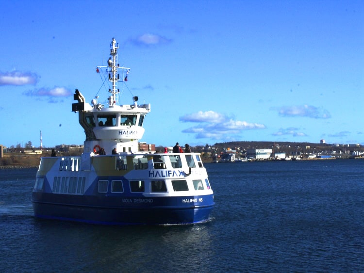 Small white Halifax-Dartmouth Ferry at sea near the city