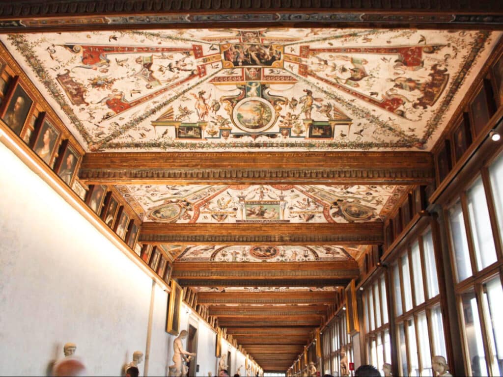 View of the intricate ceiling seen from the hallway of the Uffizi Gallery