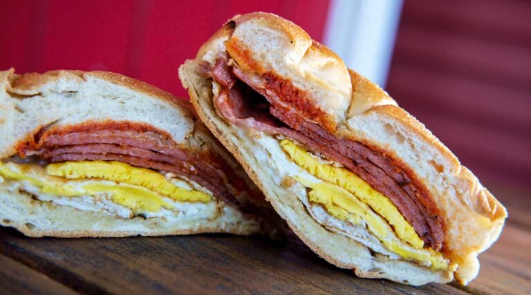 A Taylor ham, egg, and cheese sandwich cut in half