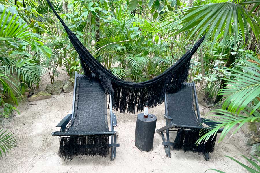 Chairs and a hammock in NEST Tulum