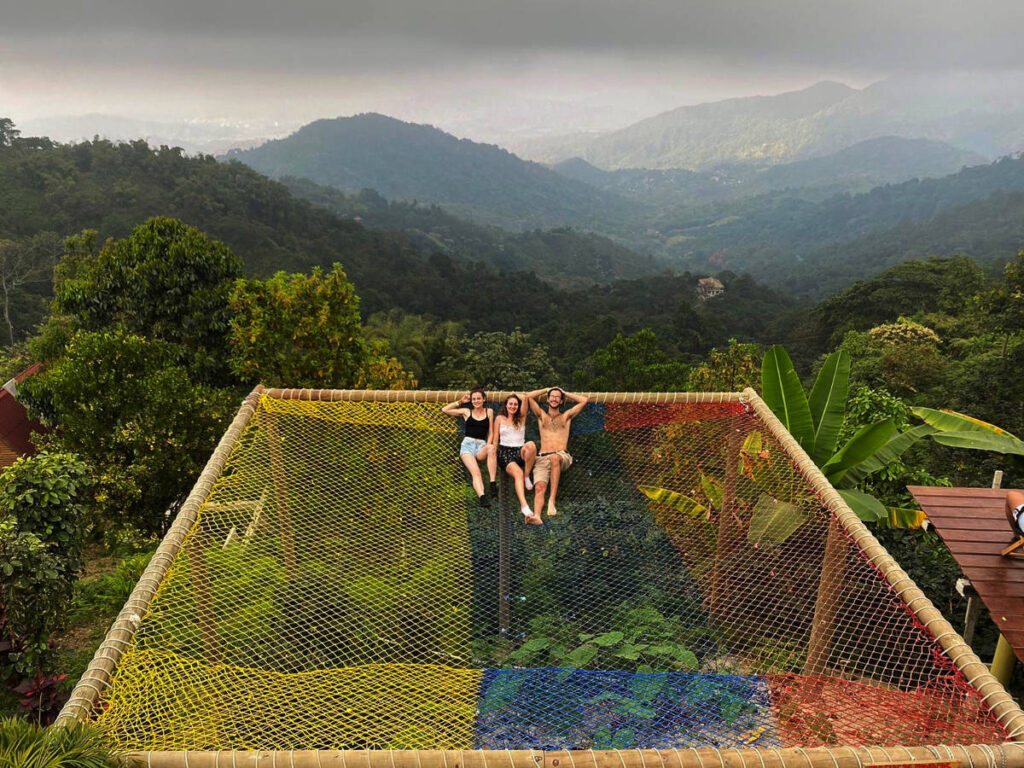 Author Sky and friends chilling at a Hammock over the edge of a mountain