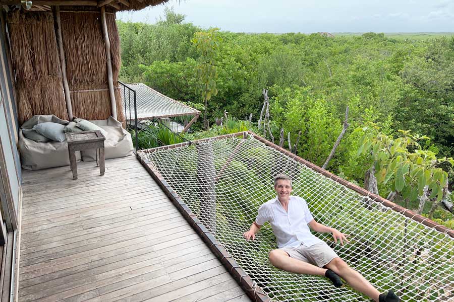 Nate on a giant hammock in Radhoo Tulum
