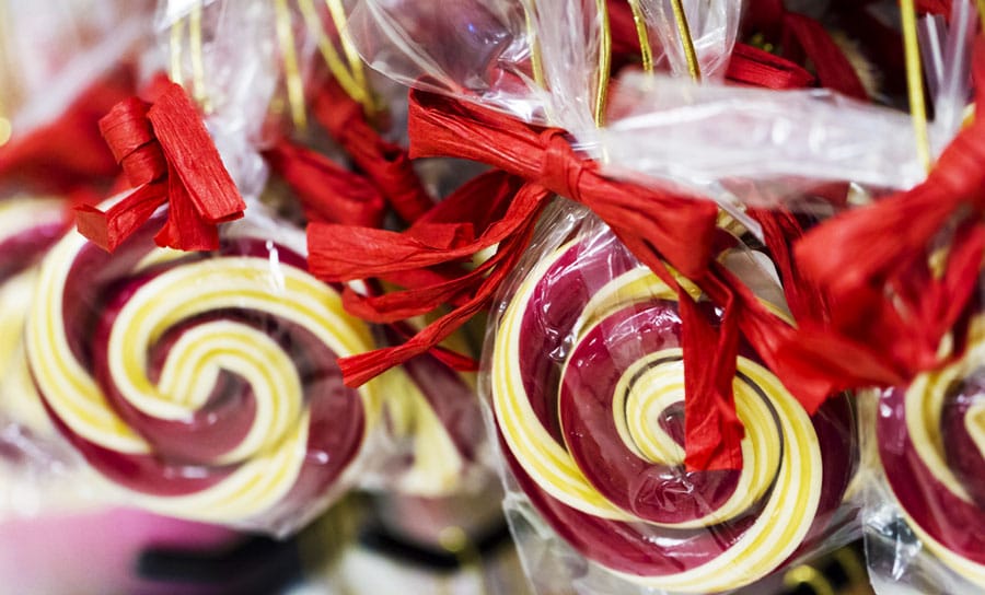 View of candies wrapped on a plastic with ribbon on it