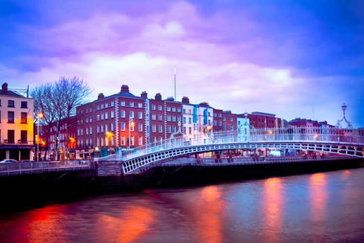 View of Ha'penny Bridge in Dublin at sunset