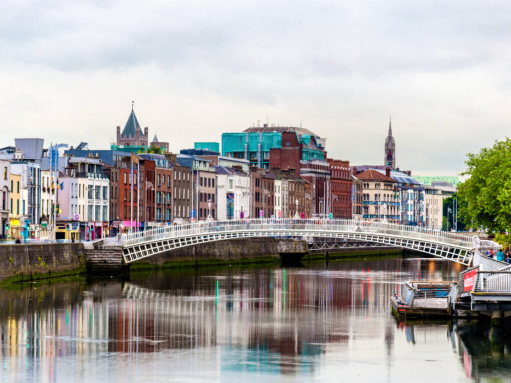 The Ha'penny Bridge over the river with the colorful buildings around