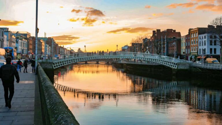 View of the Ha'penny bridge and Liffey river lights at sunset