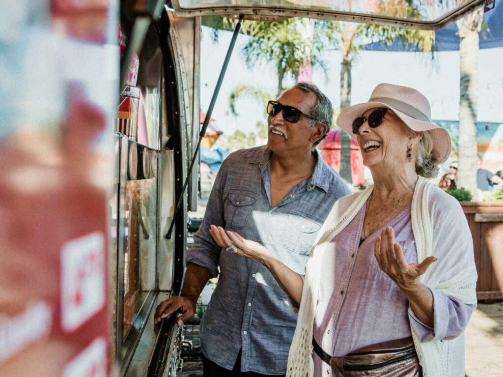 A senior couple laughing