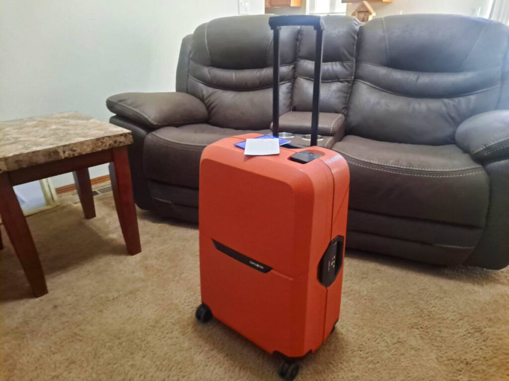 A hard case luggage at the living room