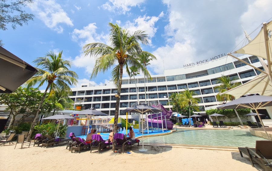 View of pool and loungers at the Hard Rock Penang Hotel