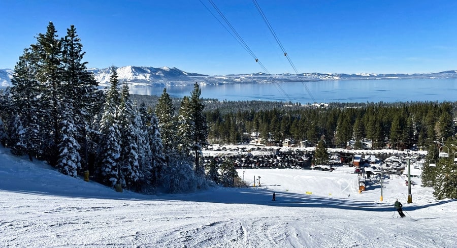 Scenic view of the lake, snow covered trees and mountains from a ski resort in California.