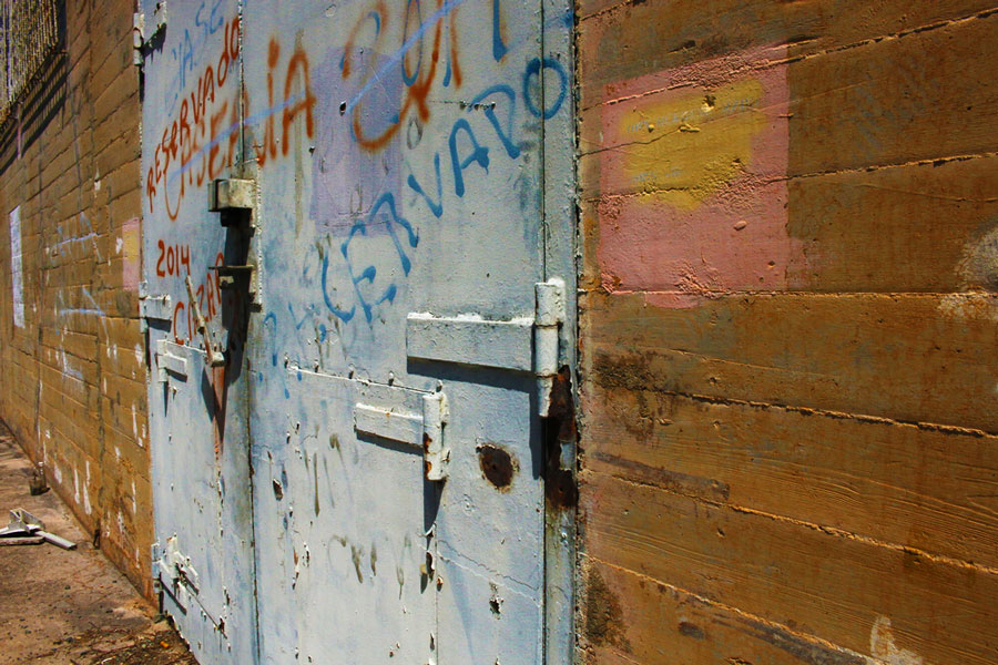 View of a bunker door with graffiti on it in Vieques