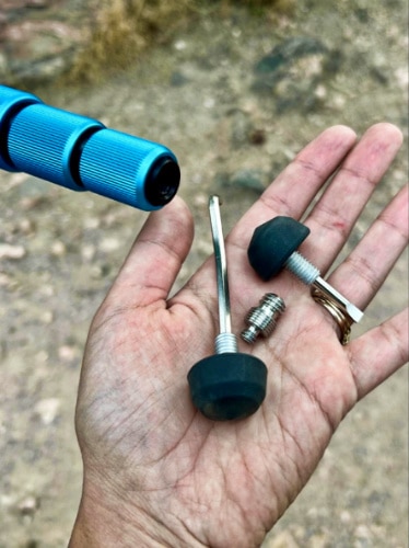 Closeup look of the hidden tools on the feet feature of MeFOTO Roadtrip PRO Tripod