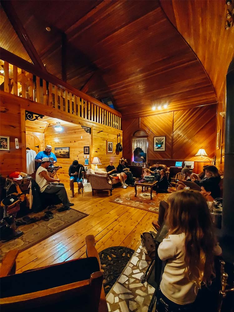 People relaxing inside Highlands Hostel
