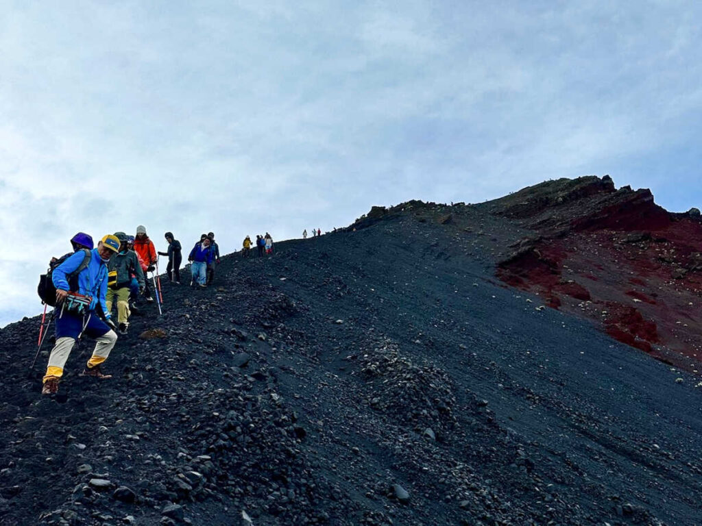 A group of hikers descending from the summit of Mt. Rinjani