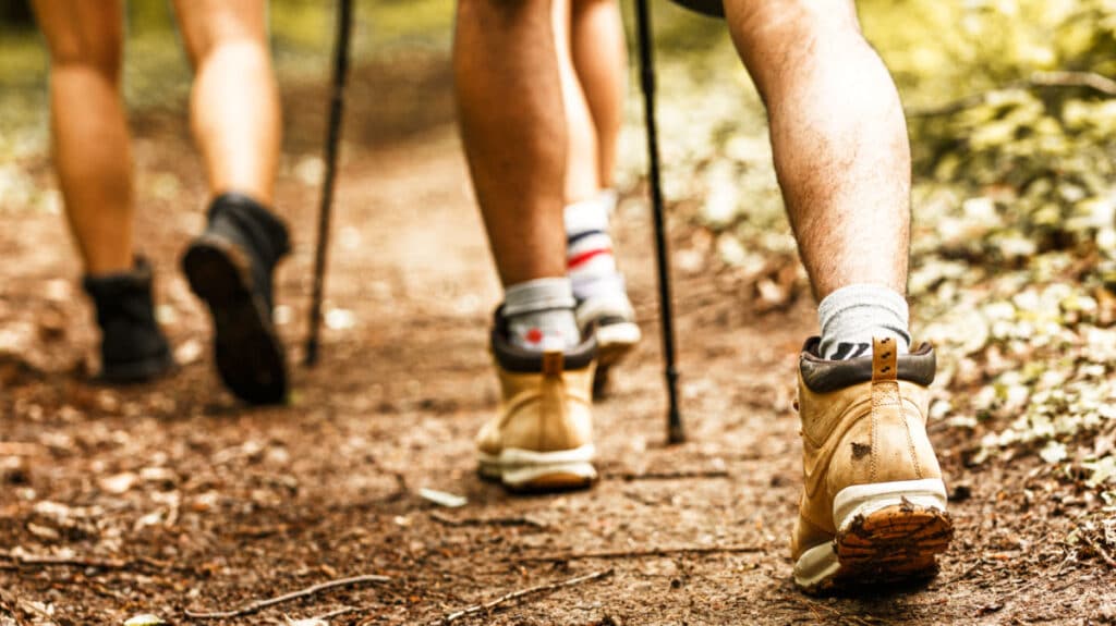 Closeup look of the hikers feet walking along the trail