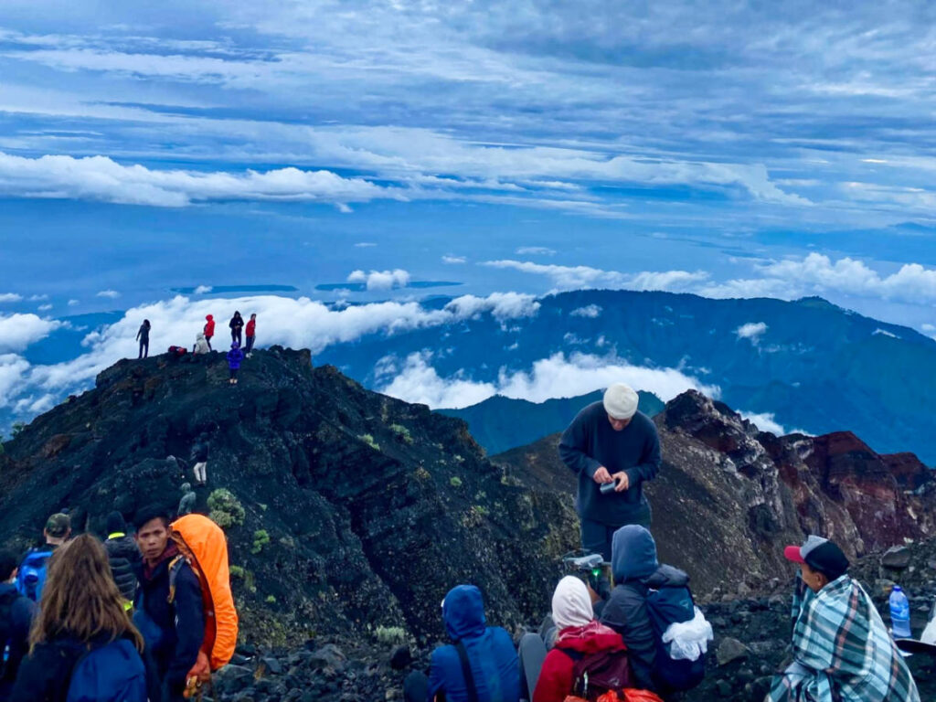 A group of hikers on the summit of Mt. Rinjani