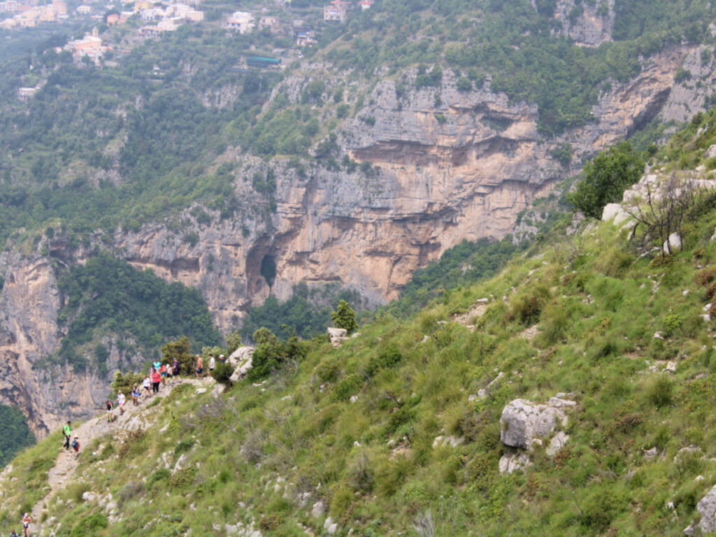 People trekking on a mountain side