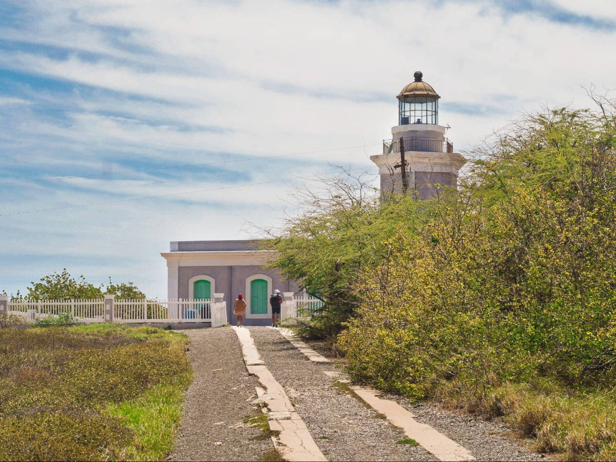 View of hikers at the Los Morrillos Lighthouse