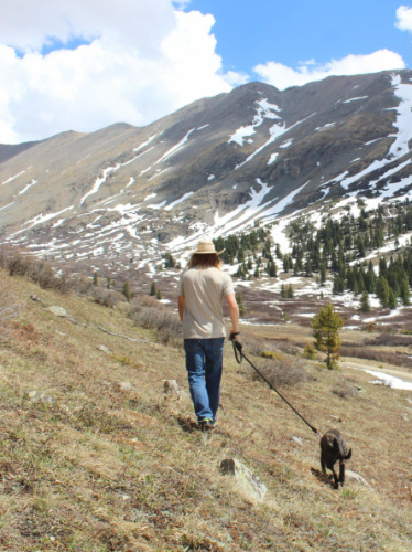 Abigail Bliss' husband with their dog during a hike