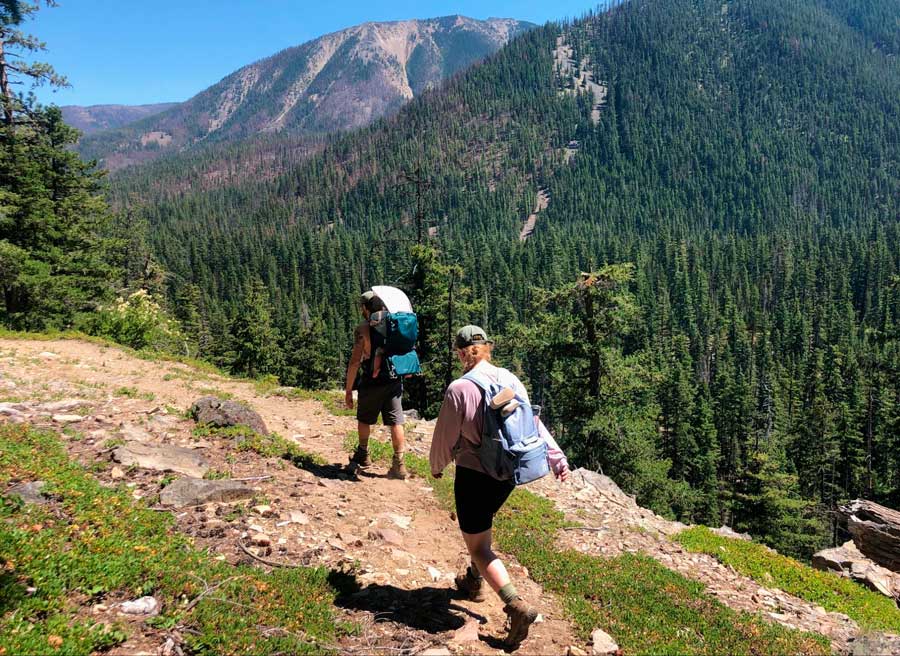 The author's friends hiking on a sunny day