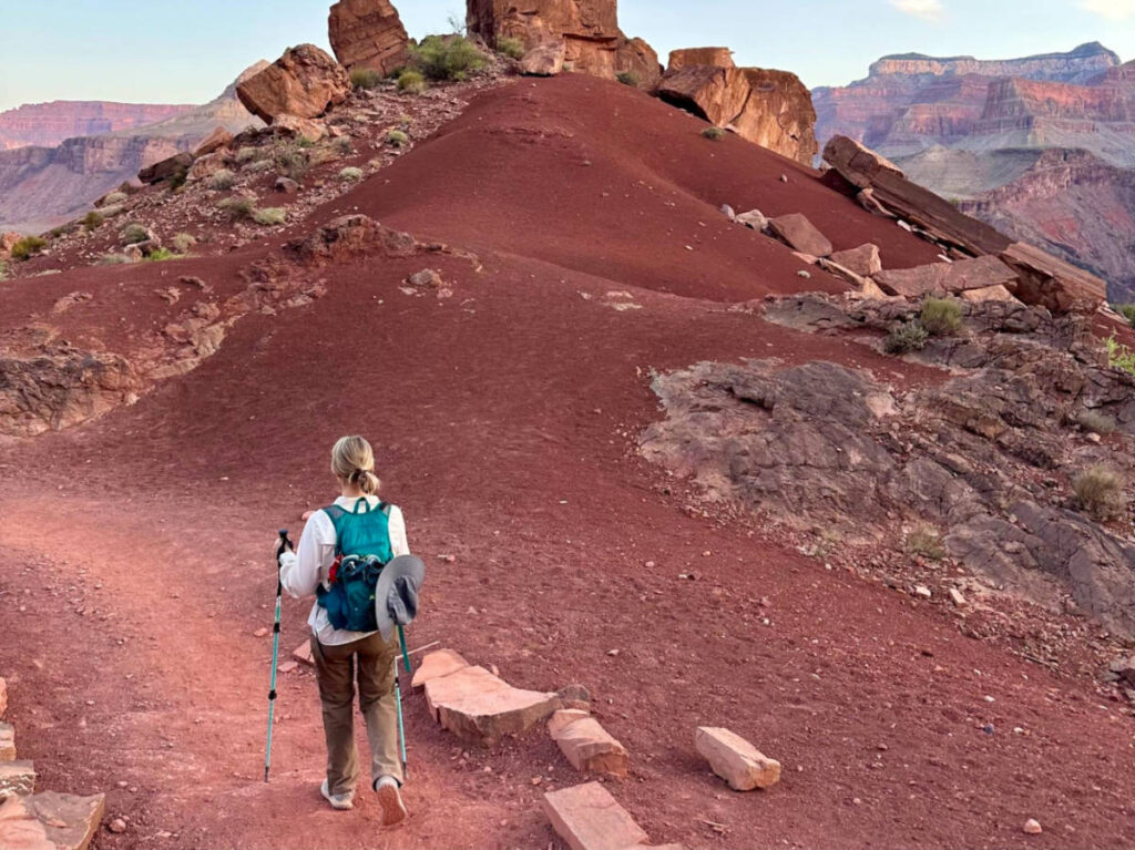 A woman with a light bag hiking the Grand Canyon