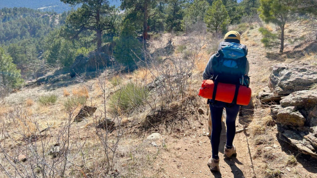 The author with her dog during a hike in Colorado