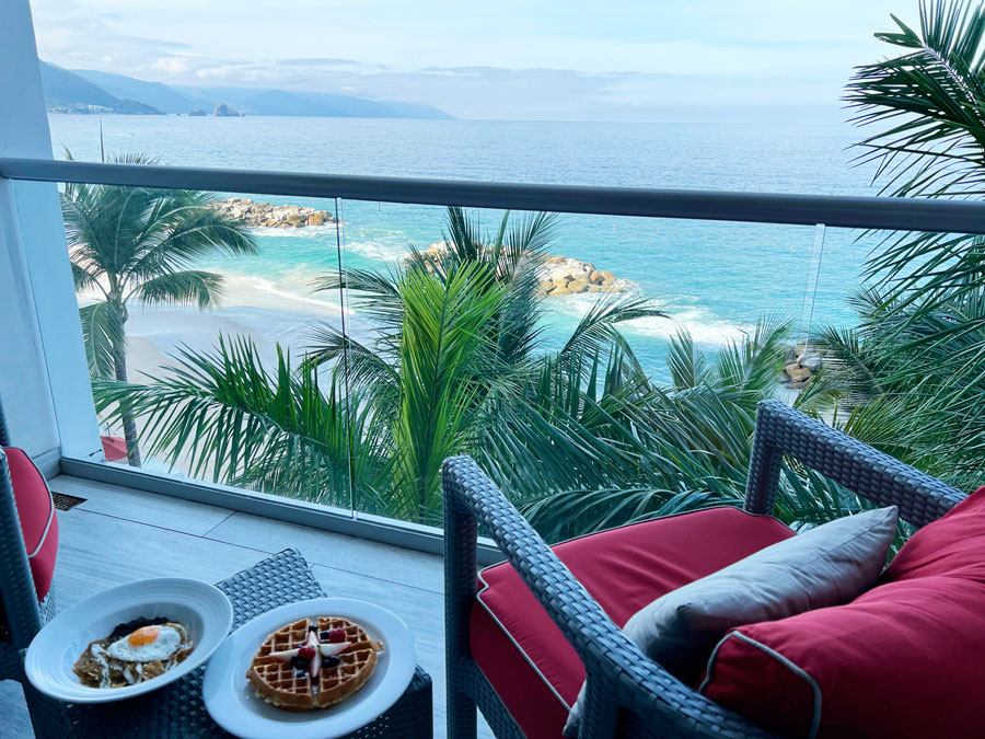 View of breakfast meals on a table in a balcony in Hilton Riviera Resort