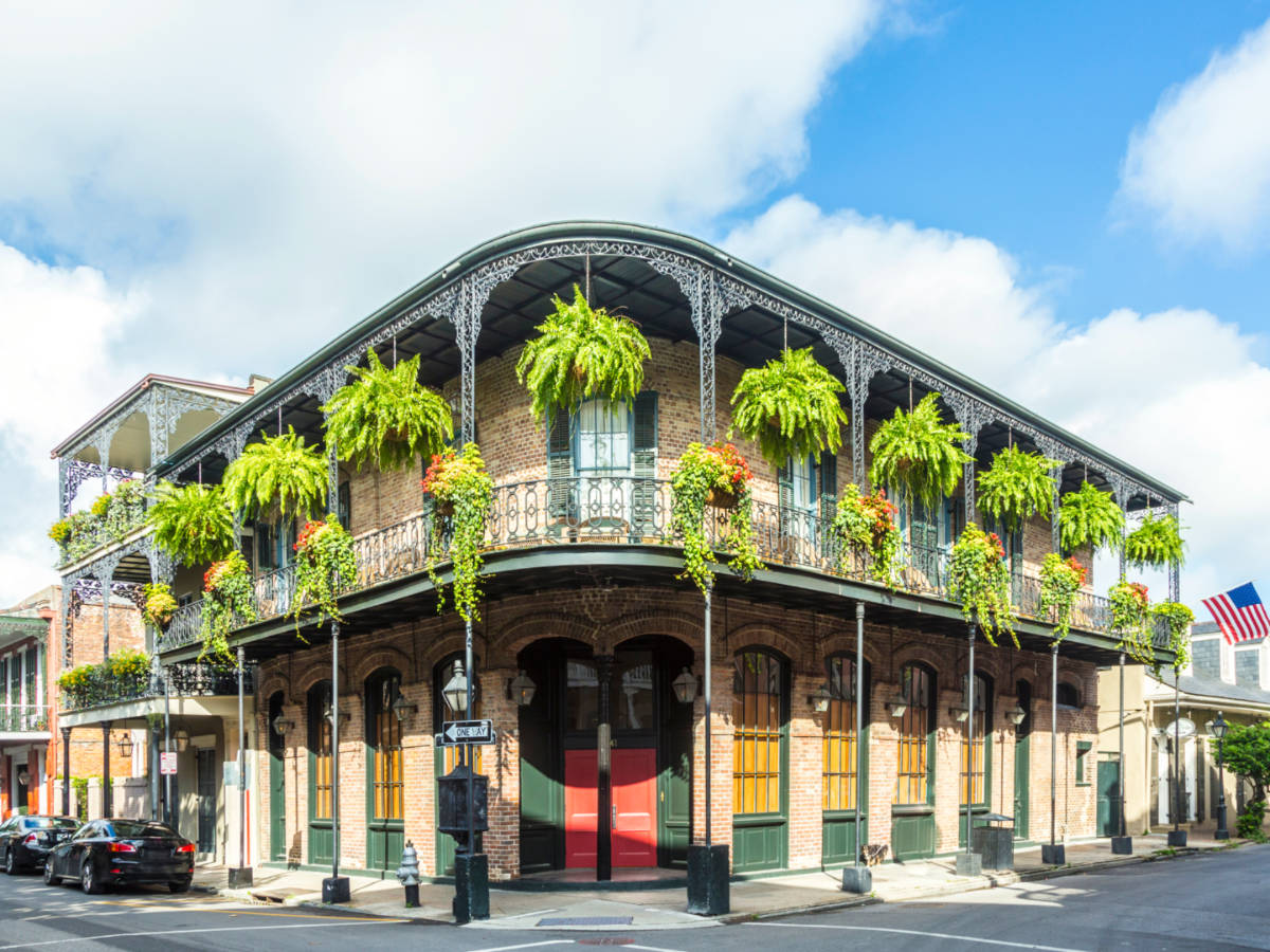 Facade of the historic buildings in the French Quarter, seen from the corner of the street